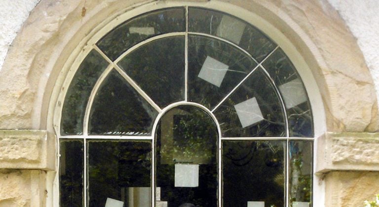 Replacing Glass in an arched window = Manchester sash window specialist
